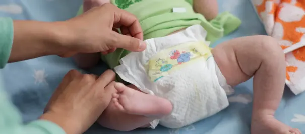 adult baby girl posing in diapers and pampers